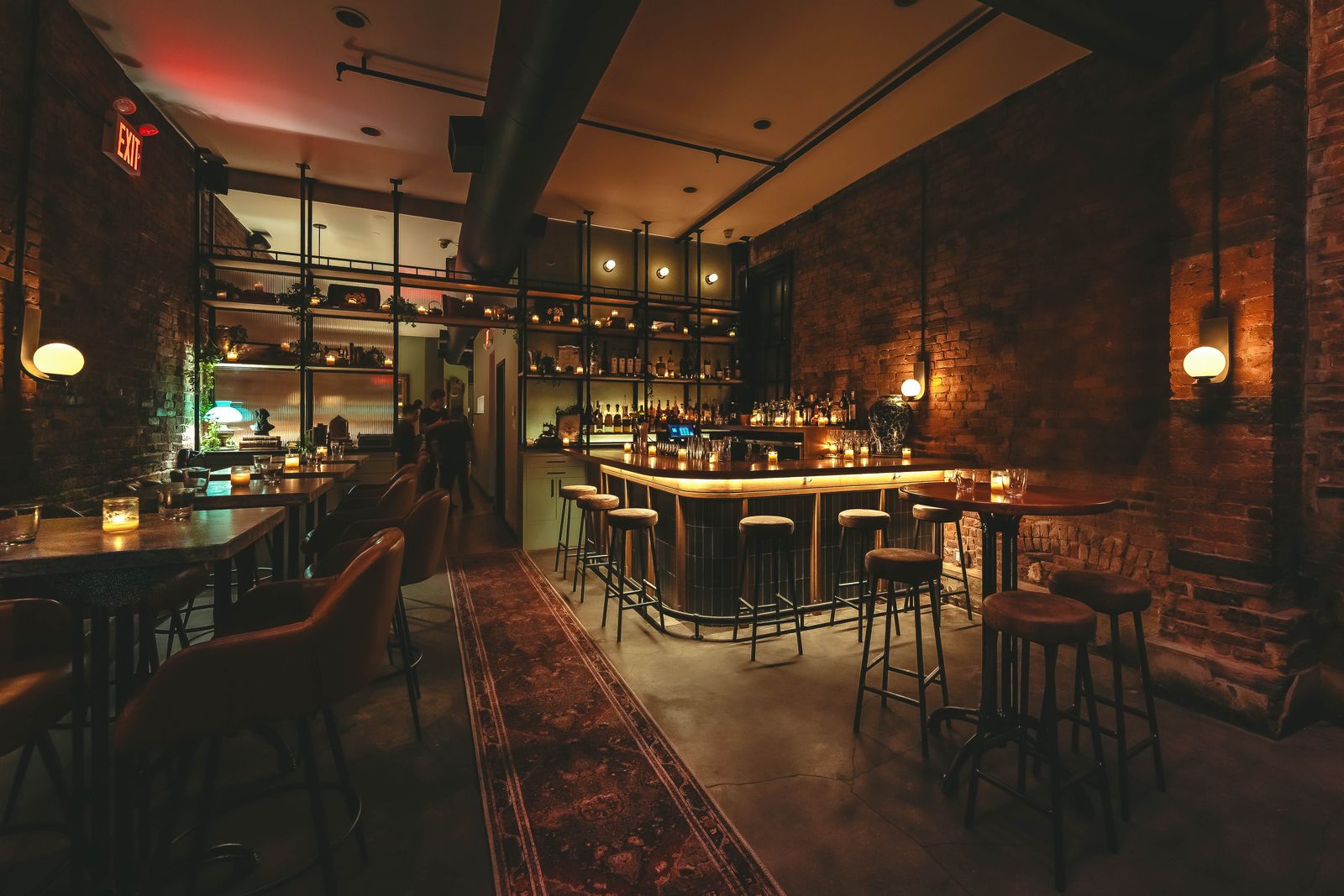 Odd Sister's bar and dining room, exposed brick and a patterned runner